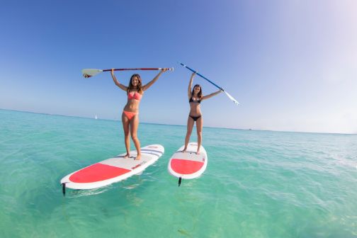 two women on paddle boards in cancun