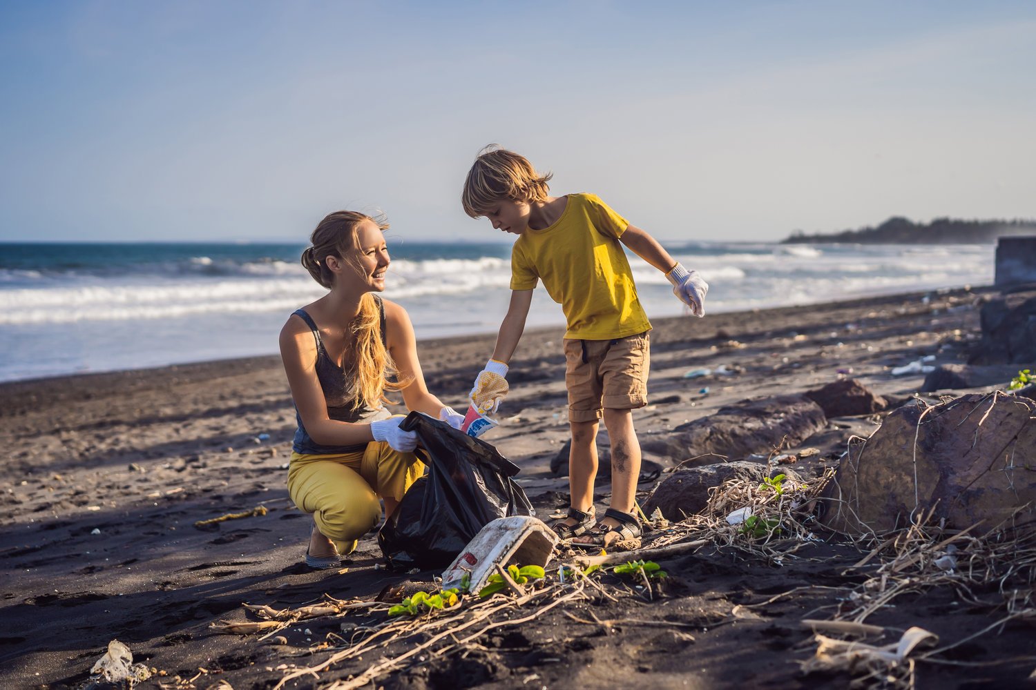 Mother Son Cleaning Beach