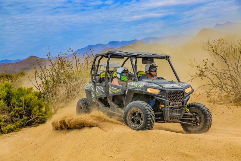 cabo vacationers on atv tour in cabo desert