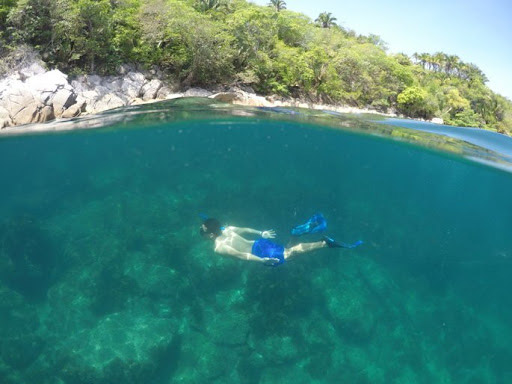 Person enjoying snorkeling in Puerto Vallarta in Majahuitas