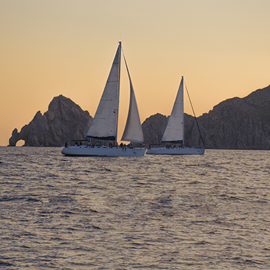 luxury sail boats at sunset in cabo