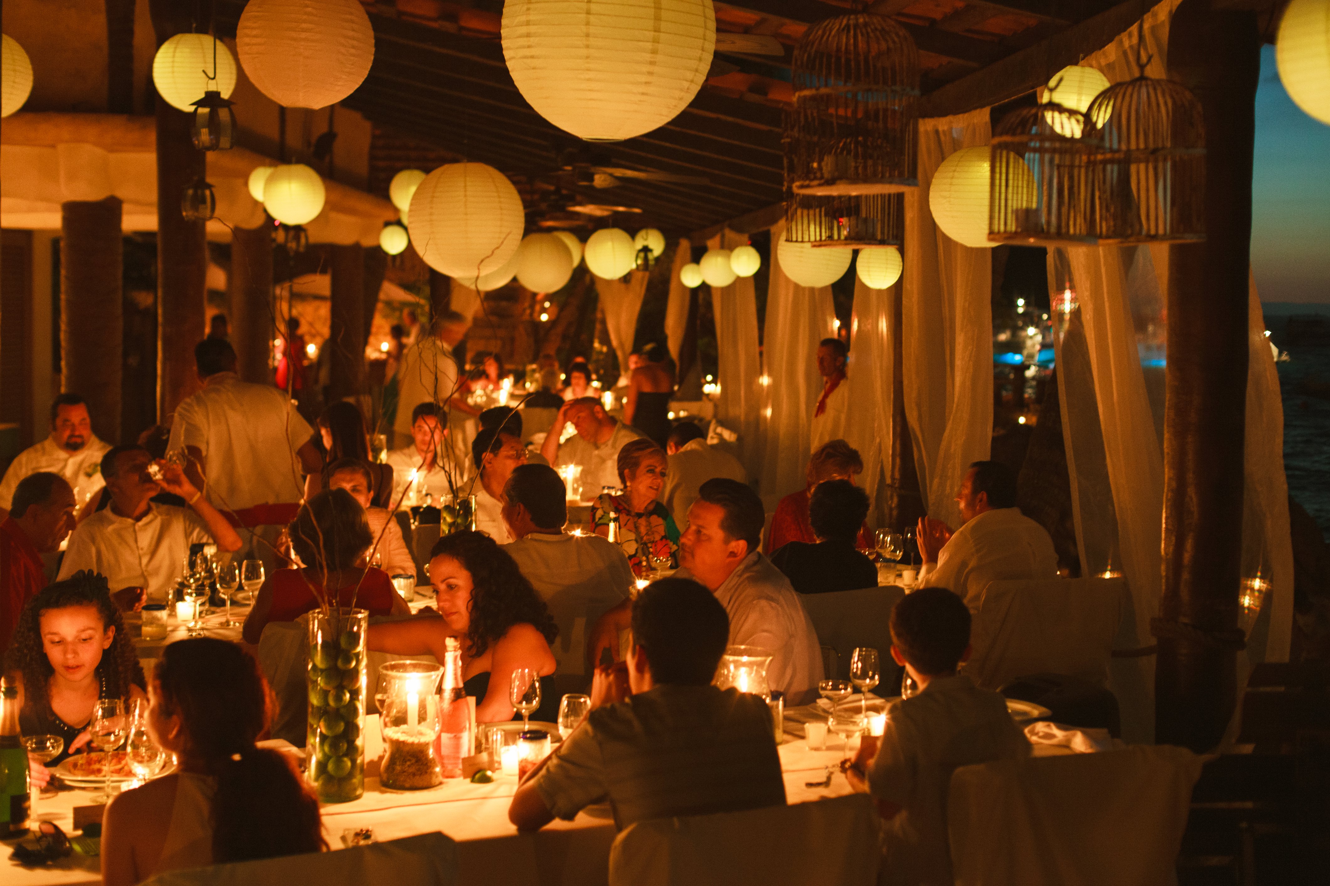 wedding guests at dining tables at las caletas beach wedding venue