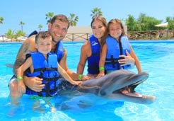 Family with a dolphin in Cabo Adventures