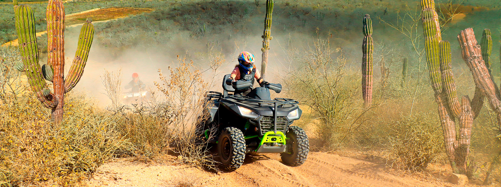 vacationers riding 4 wheelers in Cabo mexico 