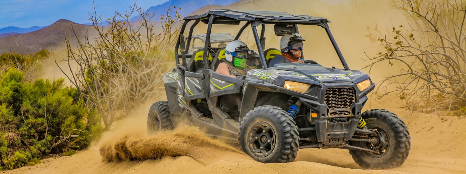 vacationers riding 4 wheelers in Cabo mexico 