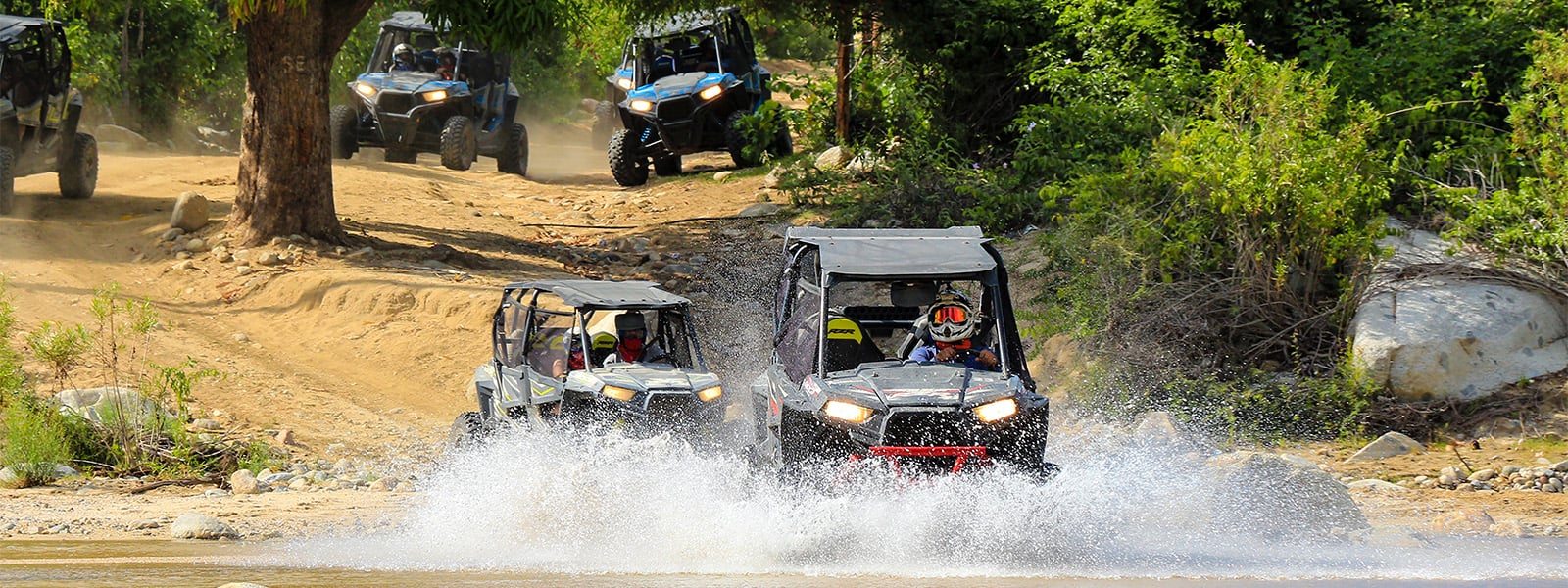 vacationers riding 4 wheelers in Cabo mexico 