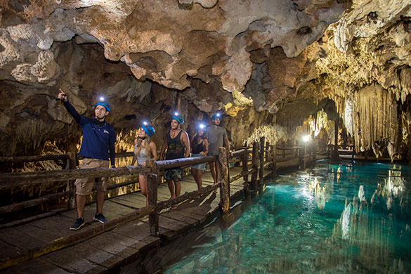 Small group tour exploring ancient caves in Tulum