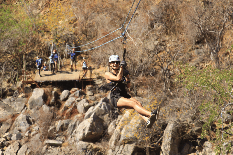 woman having fun on a cabo san lucas zipline tour