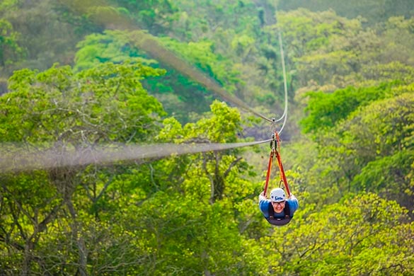 Man doing the superman zipline on our ziplining excursion in Puerto Vallarta