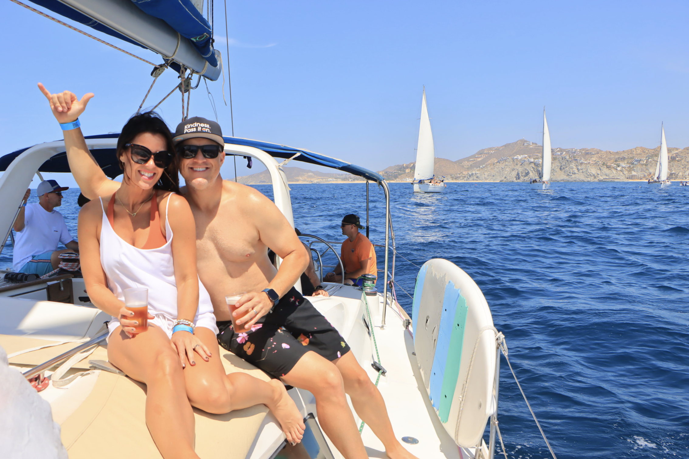 Couple relaxing on a sailing boat with Cabo Adventures