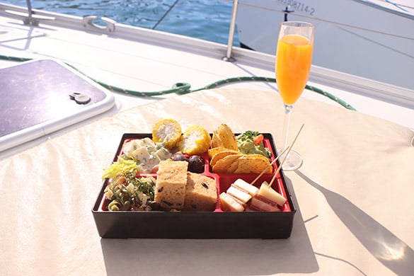 Mexican dinner and champagne glass on sailboat.
