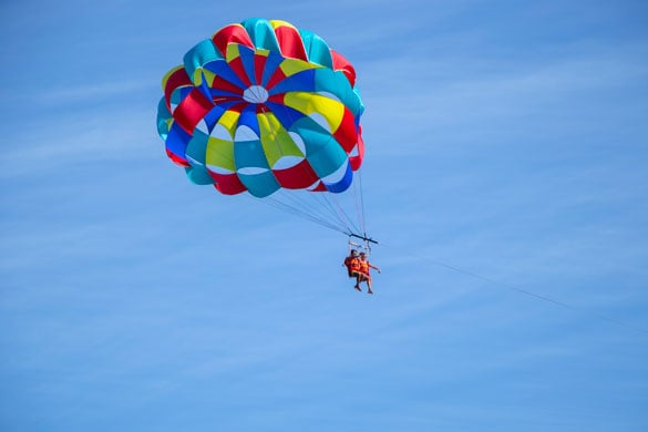 Try parasailing, the perfect combination of sea and sky