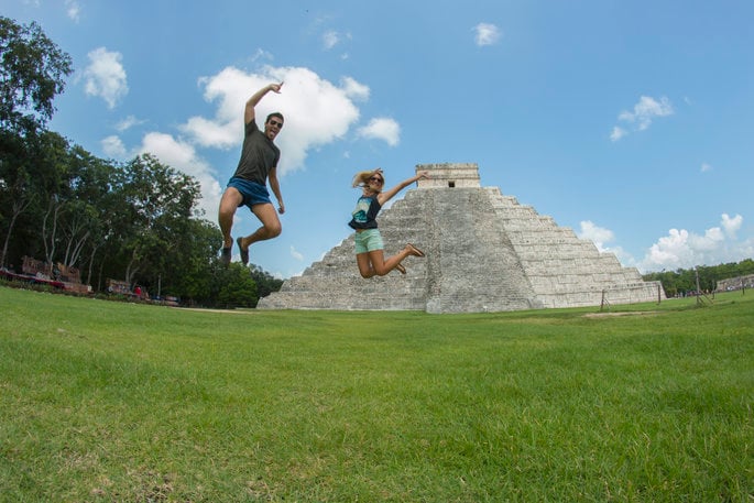 couple in front of the ruins in Chichen Itza