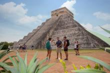 Tourists standing in front of Chichen Itza Ruin