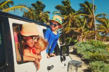 family driving off-road car on tropical cabo beach